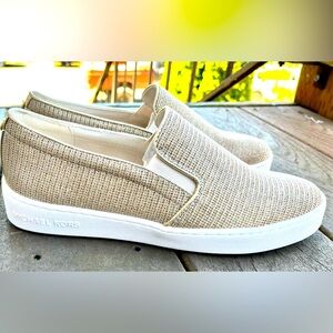 MK Keaton. Made from dazzling glitter chain mesh with metallic trim. Brand new